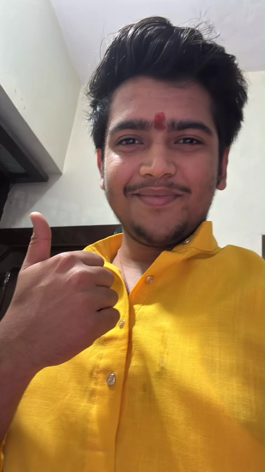 Kunal Kashyap smiling and giving a thumbs up